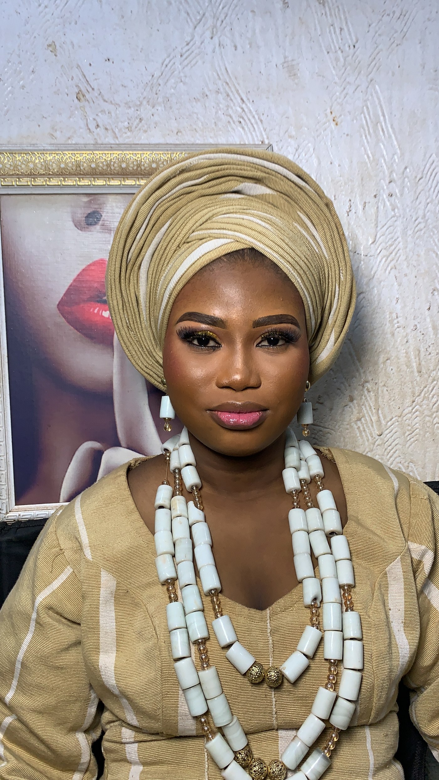 Elegant gold gele styling and bridal makeup by Dheevhn_Aribs Artistry